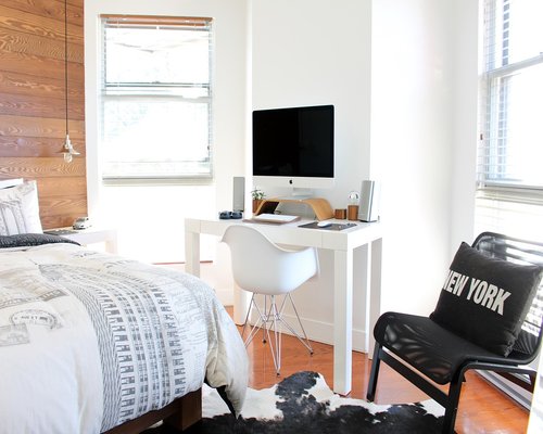 comfortable workspace with water on the desk